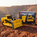 Reobrix 22001A RC track bulldozer building set — built model with its box in a quarry scene