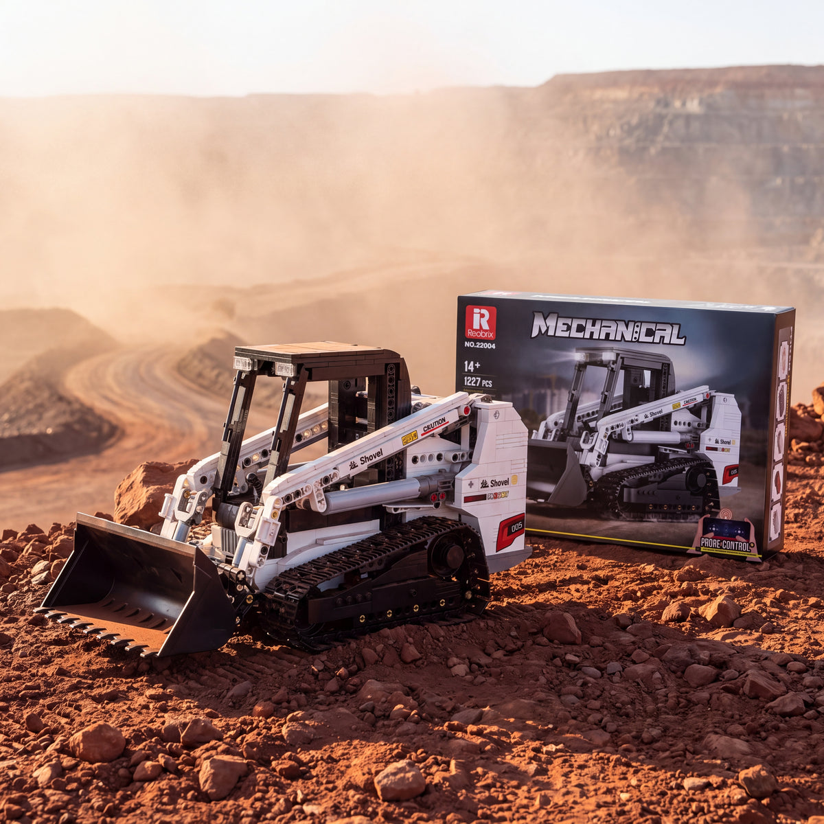 Reobrix 22004A RC compact track loader building set — built model with its box in a quarry scene