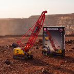 Reobrix 22006 crawler crane building set — built model with its box in a quarry scene