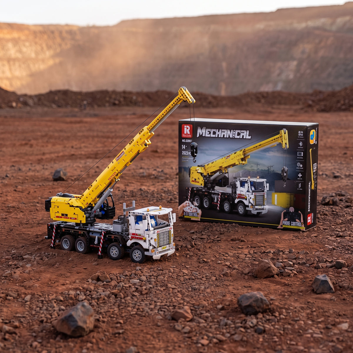 Reobrix 22007 multi-function crane truck building set — built model with its box in a quarry scene