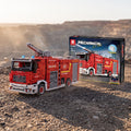 Reobrix 22008A RC fire engine with water cannon building set — built model with its box in a quarry scene