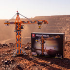 Reobrix 22013 RC tower crane building set — built model with its box in a quarry scene