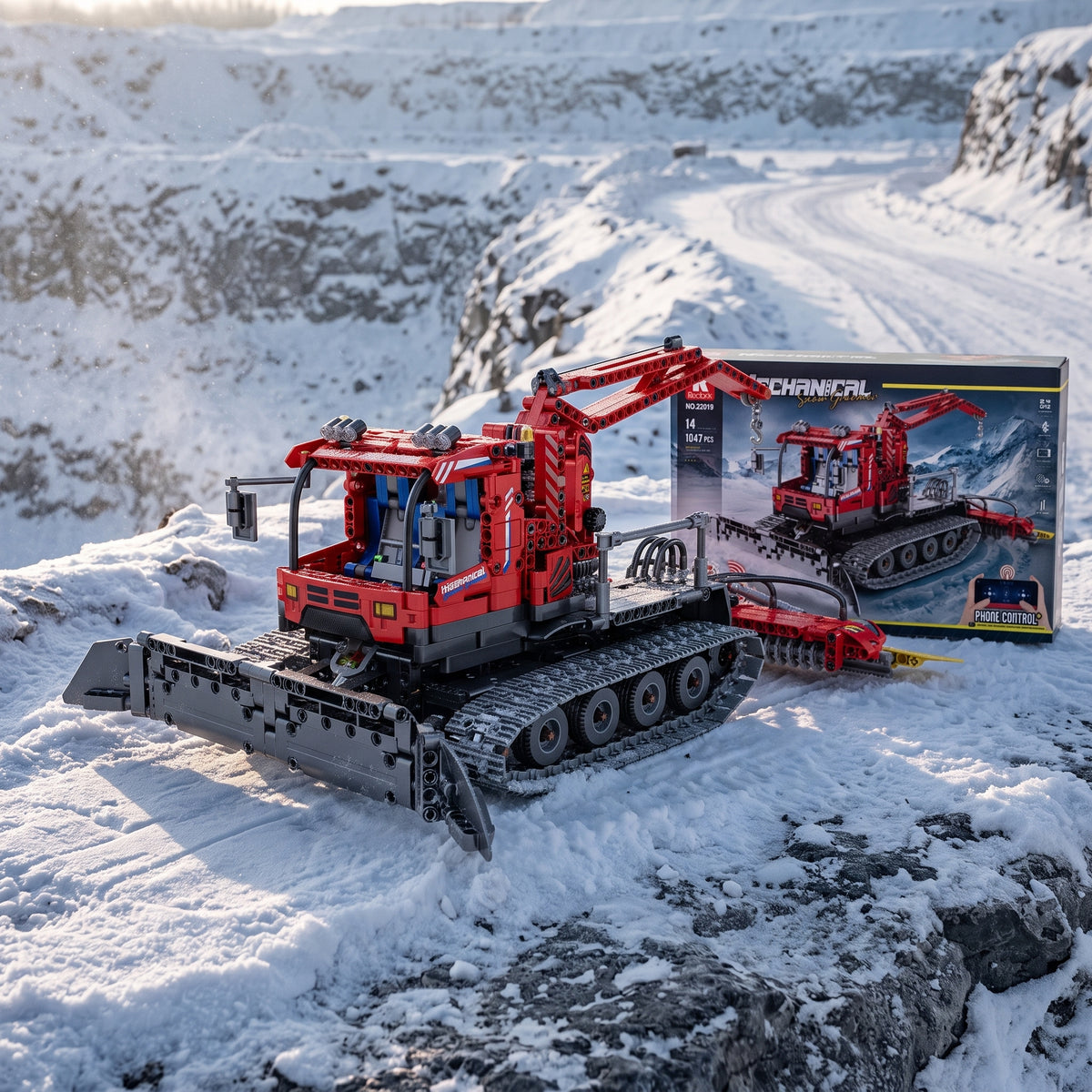 Reobrix 22019 snow groomer building set — built model with its box on a snowy slope