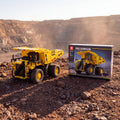 Reobrix 22025 RC mining dump truck building set — built model with its box in a quarry scene