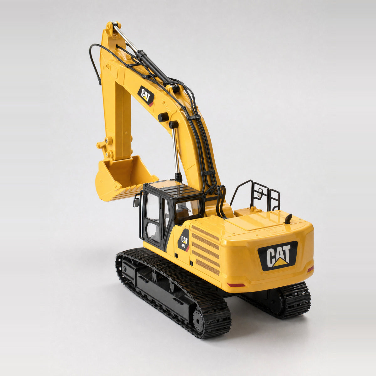 CAT 336 excavator 1:24 RC — front three-quarter view, boom raised