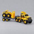 Cat® Heavy Movers semi truck with flatbed trailer carrying a Cat® wheel loader