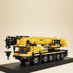 Mould King 17073 5-axle mobile crane building set, yellow — built model on display base, side view