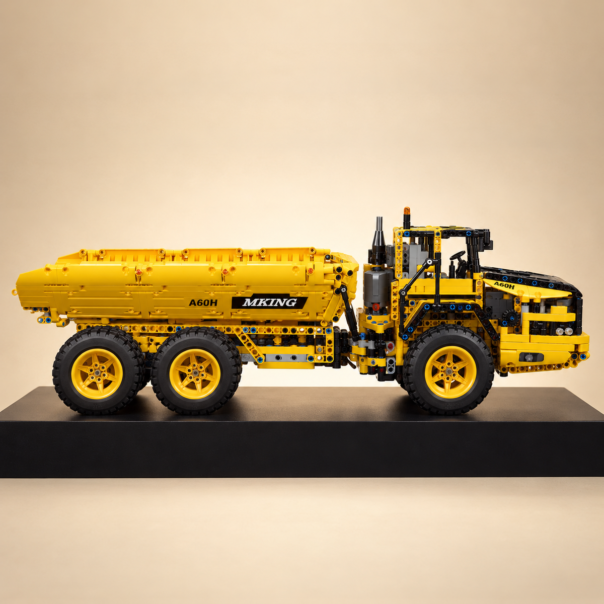 Mould King 17010S RC dump truck building set — built model on display base, side view