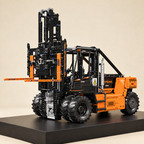 Mould King 17044 RC heavy-duty forklift building set, orange — built model on display base, front three-quarter view