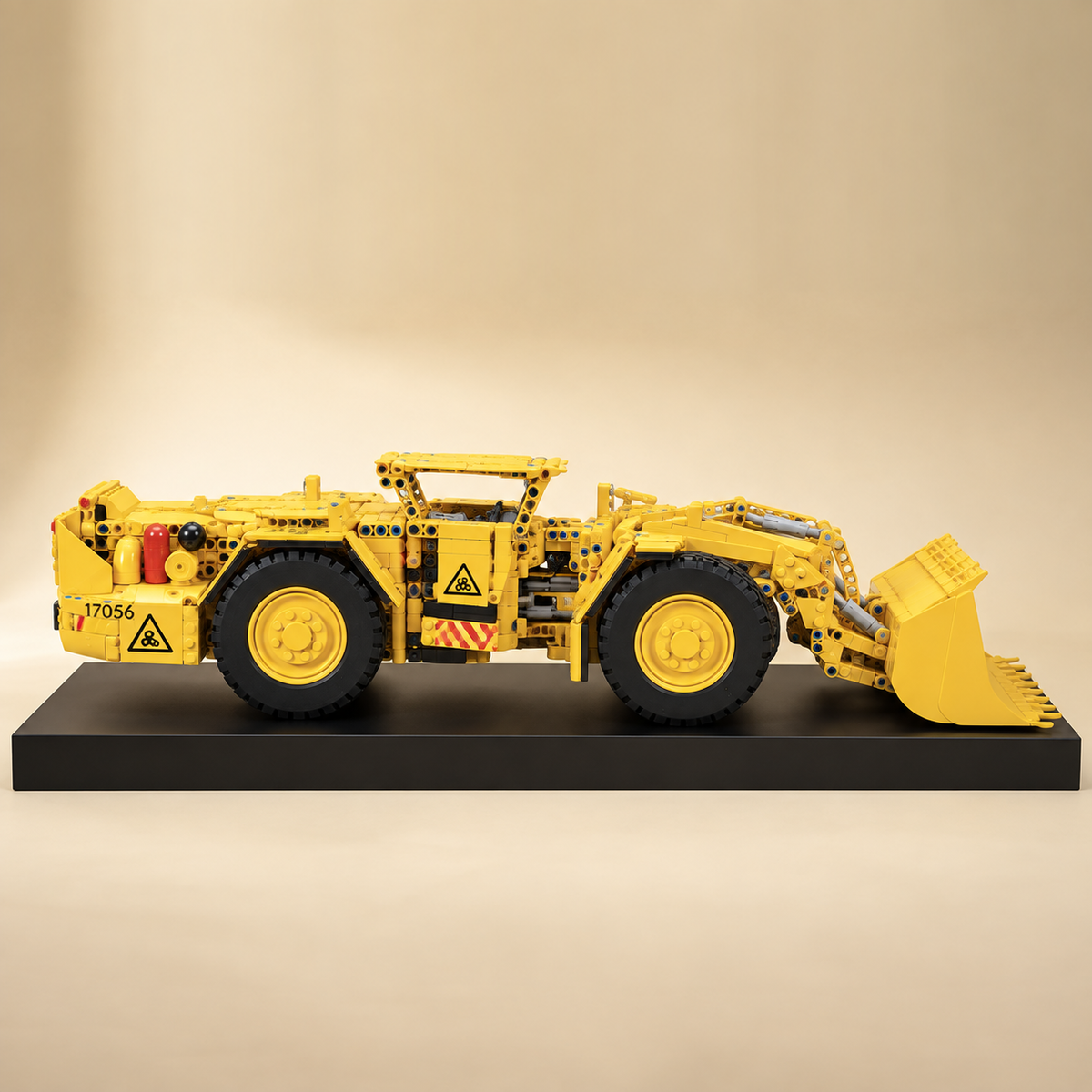Mould King 17056 underground mine loader building set — built model on display base, rear three-quarter view