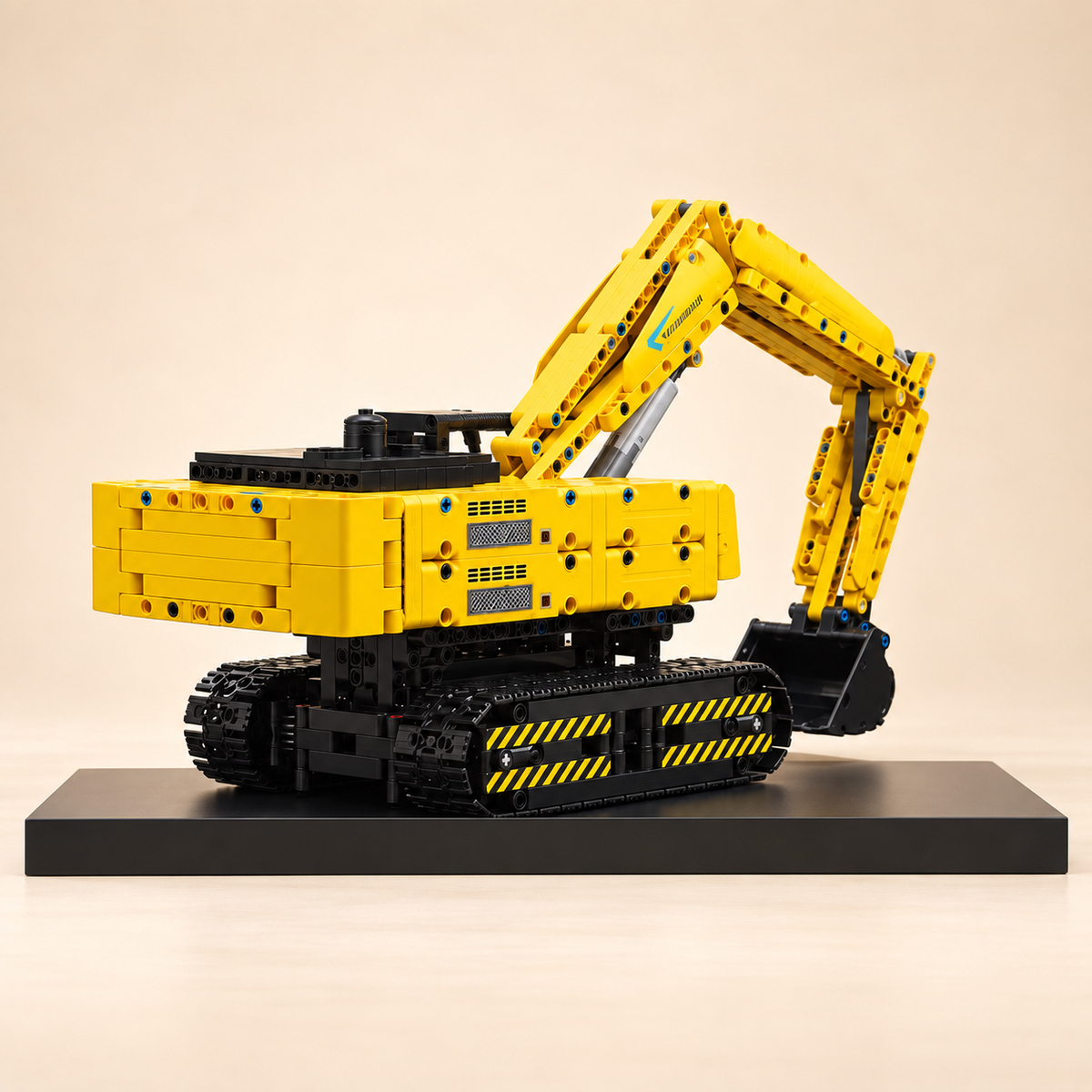 Mould King 15061 RC excavator building set, yellow — built model on display base, rear three-quarter view